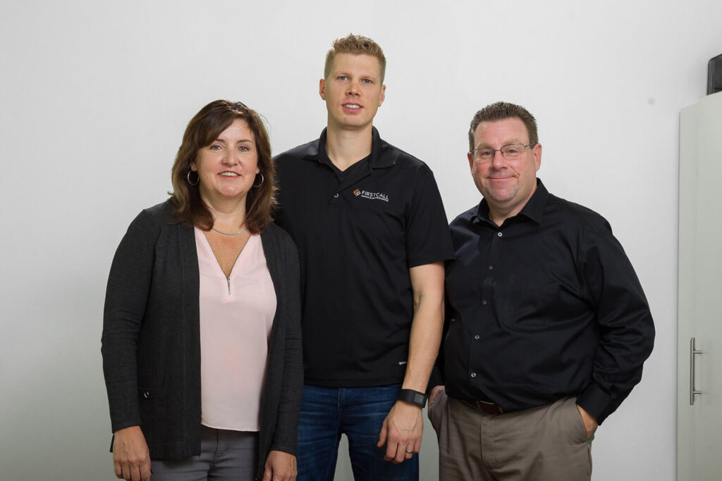 first call heating owners standing together for a team photo